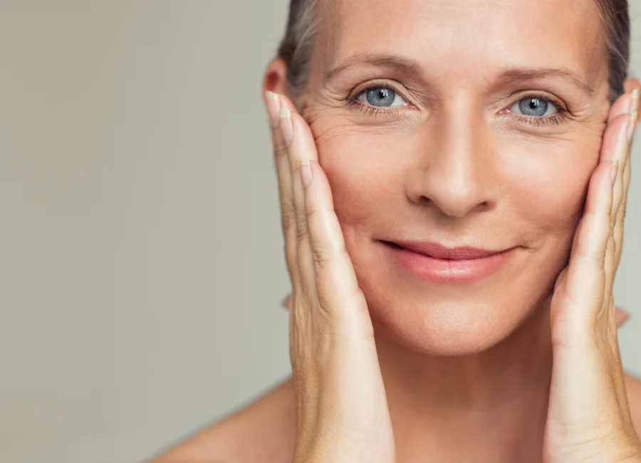 smoothing swrinkles on the face of an older woman