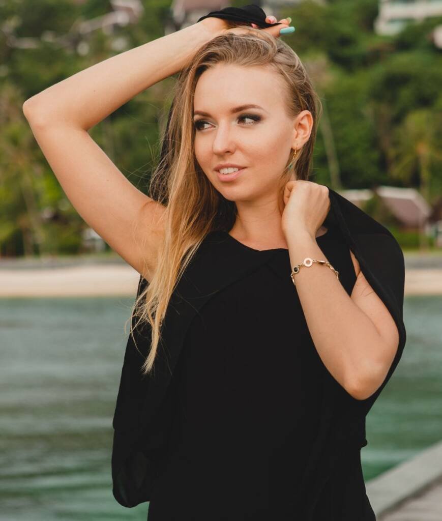 woman dressed in black dress posing